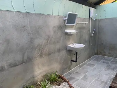 a bathroom with a sink and a shower at Baan Pongam Resort in Ao Nang Beach