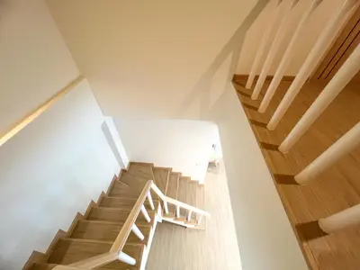 a staircase in a house with wooden floors at 48 House in Patong Beach