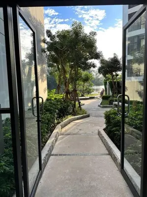 a view of a sidewalk from a window of a building at Квартира Cassia Residences Lake View in Bang Tao Beach