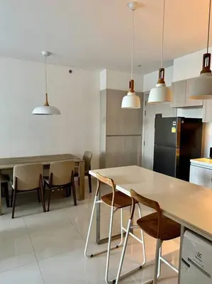 a kitchen with a table and chairs and a refrigerator at Квартира Cassia Residences Lake View in Bang Tao Beach