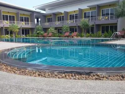 a swimming pool in front of a hotel at Gypsy Sea View Resort- Phi Phi Island in Phi Phi Don