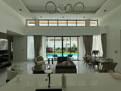 a living room with a couch and a table at Luxury Breeze Villa with private pool & maid in Bang Tao Beach