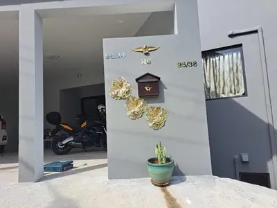 a wall with a plant in a pot next to a door at Seaview Eagles Nest Apartments in Rawai Beach