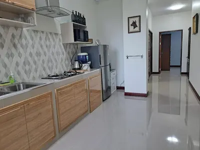 a kitchen with a sink and a refrigerator at Seaview Eagles Nest Apartments in Rawai Beach