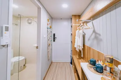 a bathroom with a toilet and a sink at Sea Sand See Sky Beach Front Resort in Phuket Town