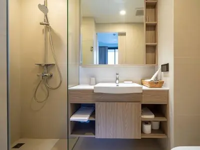 a bathroom with a sink and a shower with a mirror at 2 спальни Апартаменты на Бангтао 600 метров от моря in Bang Tao Beach