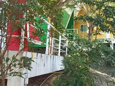 a white fence in front of a house at Mountain View Resort and Phupha Srirung Resort in Phuket Town