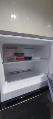 an empty refrigerator with some food items in it at Sleep tight Patong in Patong Beach