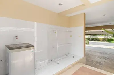 a large bathroom with a shower with white walls at Laguna Lakeview Villa in Layan Beach
