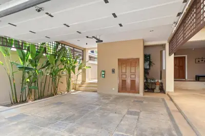 an empty lobby of a building with a door and plants at Laguna Lakeview Villa in Layan Beach