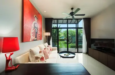 a living room with a white couch and a red lamp at Вилла с бассейном на Най Харн, 2 спальни G3 in Rawai Beach