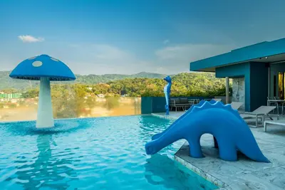 a swimming pool with a blue bear in the water at Private apartment at Oceana Resort by Lofty in Kamala Beach