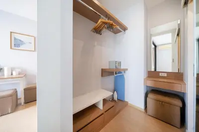 a dressing room with a bench and a mirror at Private apartment Zcape2 near Boat Avenue in Bang Tao Beach