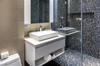 a bathroom with a white sink and a shower at Private apartment at Twin Sands by Lofty in Patong Beach