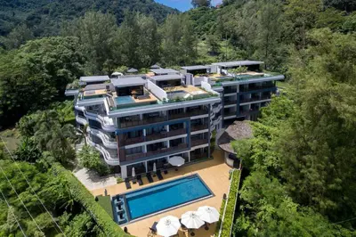 an aerial view of a building with a swimming pool at Luxury Rooftop Penthouse in Kamala Beach