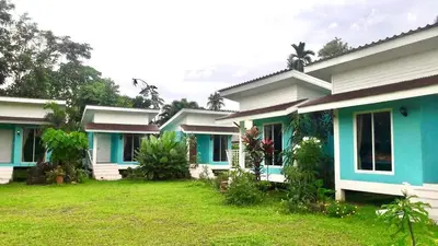 a row of houses with blue and white at Yada Resort Koh Yao Noi in Ko Yao Noi