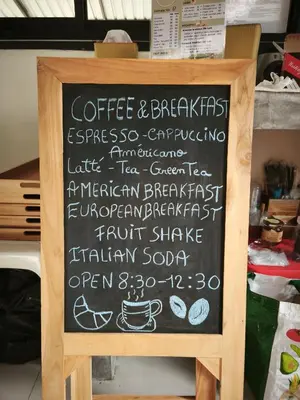 a chalkboard menu for a coffee andbreakfast restaurant at The Secret Garden Koh Yao Yai in Ko Yao Yai