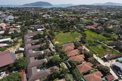 an aerial view of a city with houses and trees at Tropical 3BR Pool Villa Prima, just 5min Drive to NaiHarn and Rawai Beach in Rawai Beach