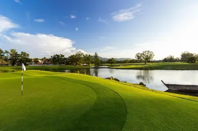 a view of a golf course with a lake at Kamala pool Villa in Kamala Beach