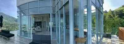a glass house with a view of the mountains at 360* Ultimate Penthouse Entire TOP FLOOR and RESORT with GREAT AMENITIES in Kamala Beach