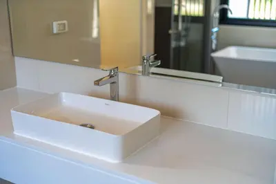 a white sink in a bathroom with a mirror at 4bdr pool villa in Laguna Park 2 in Phuket Town