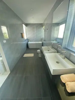 a bathroom with two sinks and a bathtub and a tub at Costa Lota villa, brand new, 3 bedroom, in rawai V35 in Rawai Beach