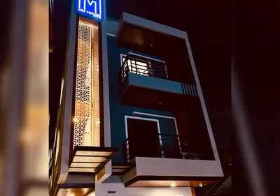 a model of a building with a sign on it at Hm House Patong in Patong Beach