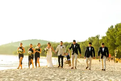 a group of people walking on the beach at Long Beach Club Krabi in Ban Nong Thale