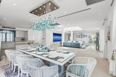 a kitchen and dining room with a table and chairs at Carpe Diem Beach Villa in Natai Beach