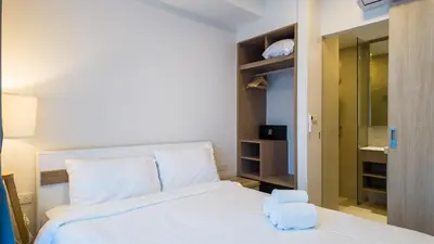 a bedroom with a white bed and a closet at Апартаменты в Laguna Skypark с террасой in Bang Tao Beach