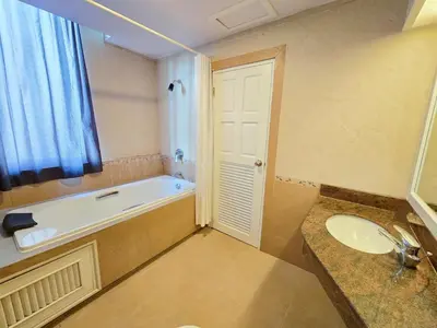 a bathroom with a bath tub and a sink at Sira Boutique, Patong in Patong Beach