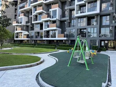 a playground in front of a apartment building at Skypark Laguna Phuket in Bang Tao Beach