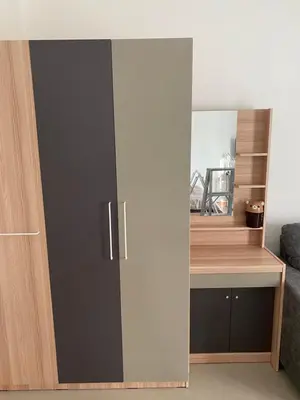 a cupboard with a door in a room at Studio Apartment in Phuket Town