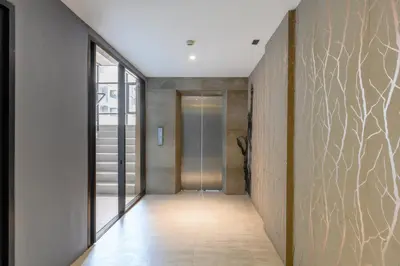 a hallway of a house with a door and a wall at City Gate Kamala N303 by Phuket Sabay Rent in Phuket Town