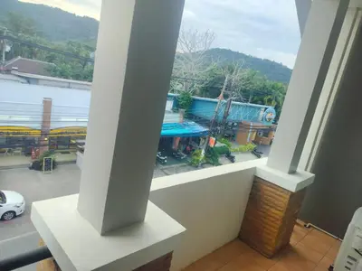 a balcony with a view of a parking lot at the three pyramids in Phuket Town