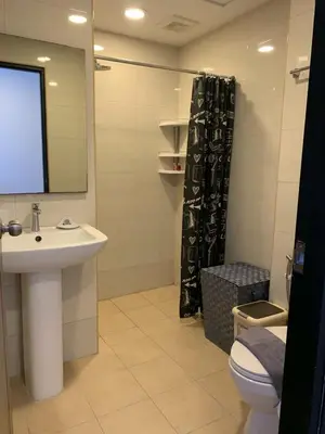 a bathroom with a sink and a toilet and a mirror at Nai Harn NBC 1 BR in Rawai Beach