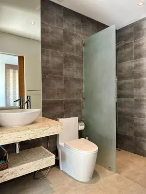 a bathroom with a toilet and a sink at Villa Amata in Phuket Town