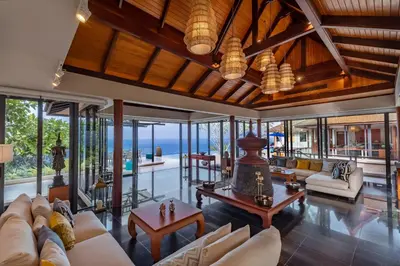 an open living room with a view of the ocean at Villa La Thale in Phuket Town