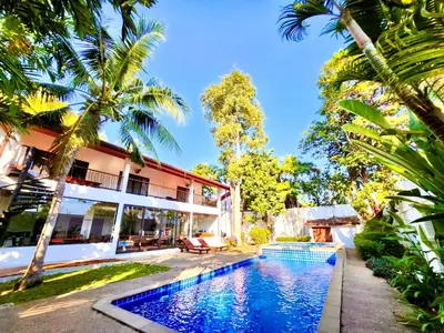 an image of a villa with a swimming pool at Coconut Palms Villa, Large & Elegant Private Pool Villa in Rawai, Phuket in Ban Saiyuan (1)