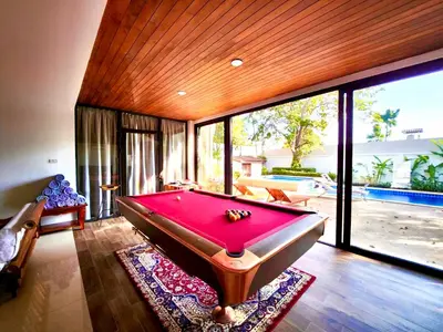 a room with a pool table in a house at Coconut Palms Villa, Large & Elegant Private Pool Villa in Rawai, Phuket in Ban Saiyuan (1)