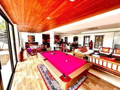 a living room with a pool table in it at Coconut Palms Villa, Large & Elegant Private Pool Villa in Rawai, Phuket in Ban Saiyuan (1)