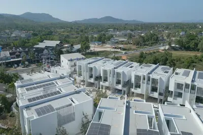 an aerial view of a building with solar panels on it at New Modern Aesthetic 3-Storey Villa A15 in Gated Residence just 10 min drive Laguna Phuket in Bang Tao Beach
