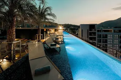 a large swimming pool on top of a building at Citygate Condo Kamala Phuket in Kamala Beach