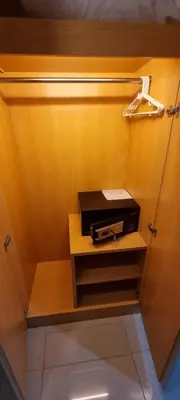 a wooden wall with a shelf with a box on it at iCheck inn Central Patong in Patong Beach