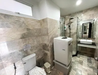 a bathroom with a toilet and a sink at Nai Harn spacious studio great amenities in Rawai Beach