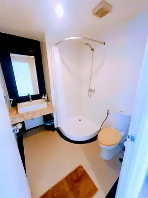 a bathroom with a shower and a toilet and a sink at Large Apartment In Lovely Panwa - All Welcome! in Ban Ao Makham