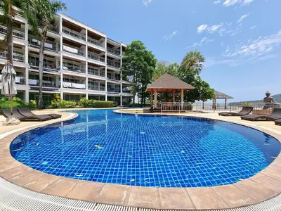 a large swimming pool in front of a building at Large Apartment In Lovely Panwa - All Welcome! in Ban Ao Makham