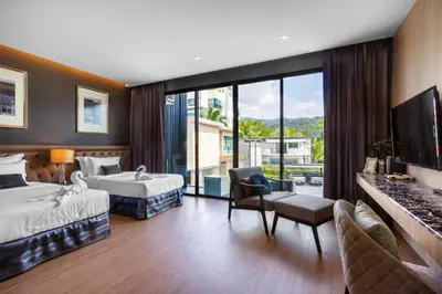 a hotel room with two beds and a tv at Luxury 2 Bedroom Private Pool Villa in Kamala Walk to Beach Shops and Dining in Kamala Beach