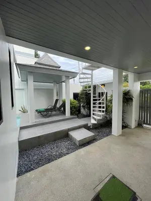 a house with a gazebo and a bench in a yard at John’s pool villa Rawai in Ban Saiyuan (1)