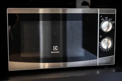 a microwave oven sitting on top of a counter at Luxury Resort City Gate Kamala C33 in Kamala Beach
